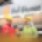 Zwei Mitarbeiter unterhalten sich vor einem Tankwagen mit der Aufschrift "Shell Bitumen"