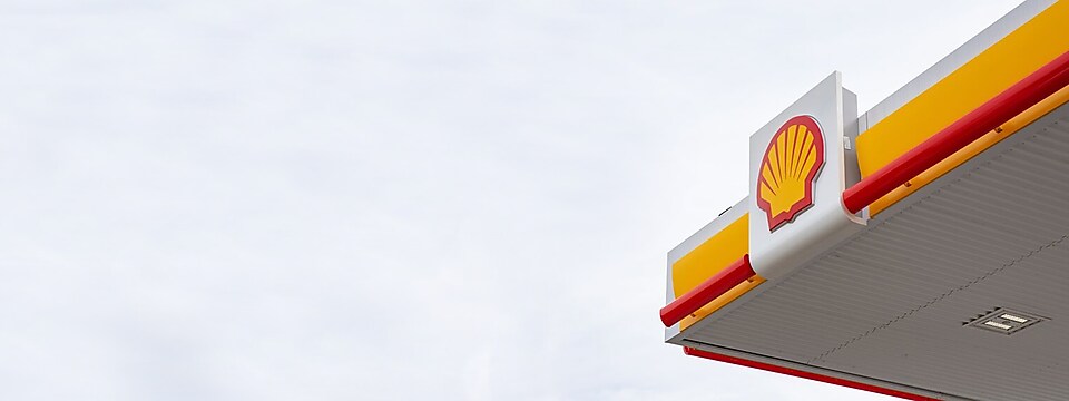 yellow banner with graphic of Shell station