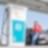 Woman using charge card at a Shell Recharge Station