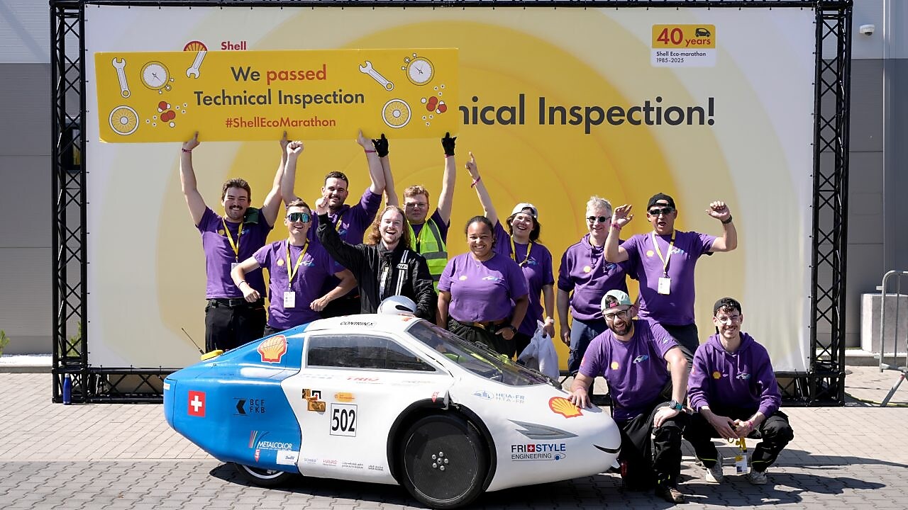 The Swiss Team Fri-Style standing behind their race car after passing technical inspection at the Shell-Eco marathon