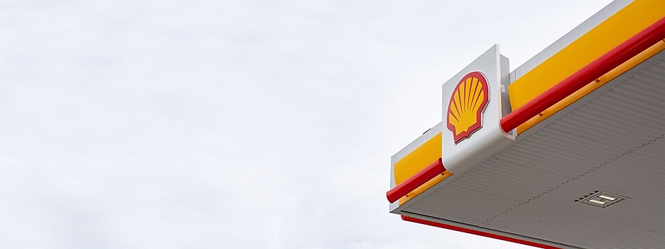 yellow banner with graphic of Shell station