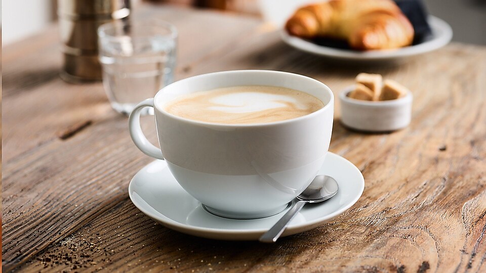 Big cup coffee on table